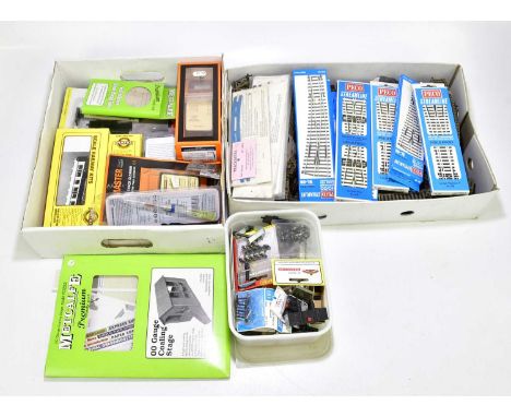 A large collection of model railway accessories, kits, rolling stock, boxed Peco Streamline HO-OO track and further track.