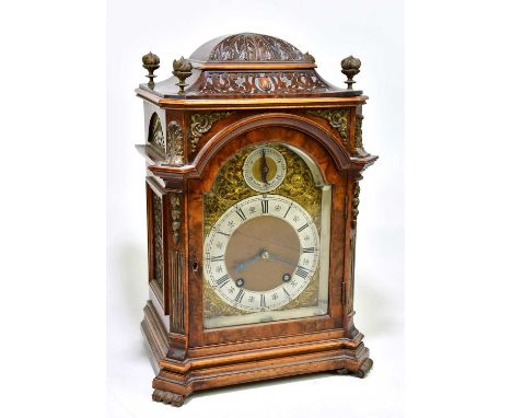 LENZKIRCH; an early 20th century German burr walnut veneered mantel clock with four gilt metal finials above applied gilt met