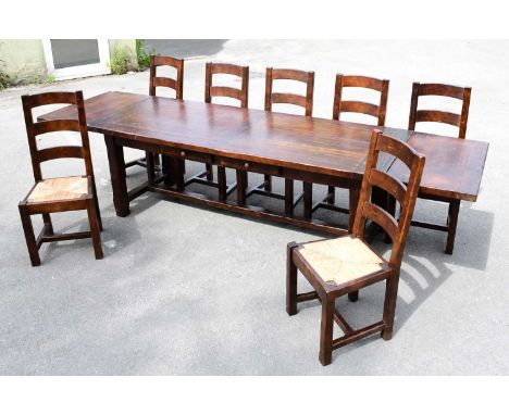 A reproduction French dark oak refectory dining table with two drawers, and two additional end leaves, length unextended 218c