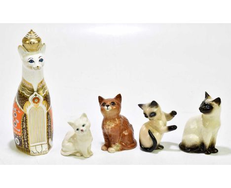 ROYAL CROWN DERBY; an animal form paperweight from the Royal Cats Series 'Siamese' (seconds quality), together with two Royal