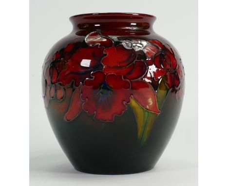 Walter Moorcroft signed Flambe vase: Decorated all around in the Orchid design, height 13.5cm.