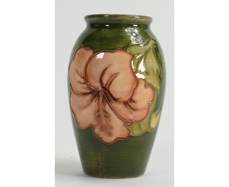 Walter Moorcroft vase decorated in the Hibiscus design: With paper label, height 11cm.