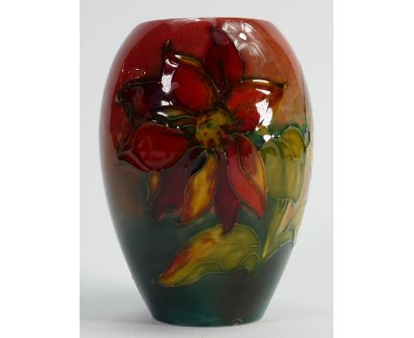 Walter Moorcroft signed Flambe vase: Decorated all around in the Clematis design, height 13.5cm. (minute glaze fault on botto