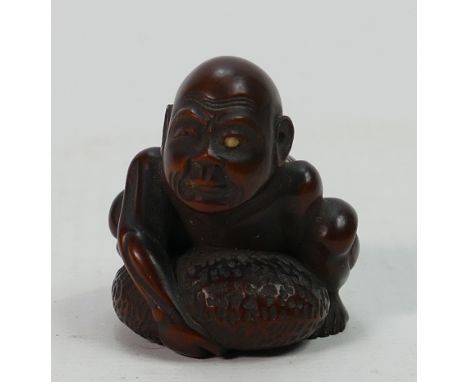 Early 20th century Boxwood Japanese Netsuke: Signed panel to base, height 3.5cm.