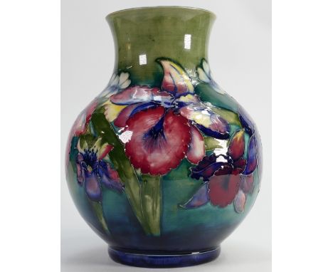 Walter Moorcroft signed vase: Decorated all around in the orchid design, height 24.5cm.