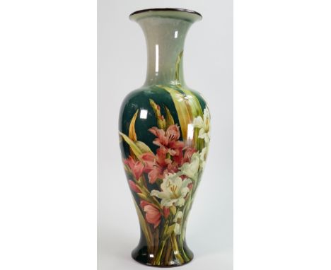 Doulton Faience vase decorated all around with flowers: By Kate Rogers, height 47.5cm.