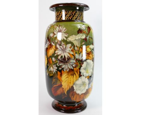 Doulton Faience vase decorated all around with flowers: By Florence E Lewis, height 43.5cm.