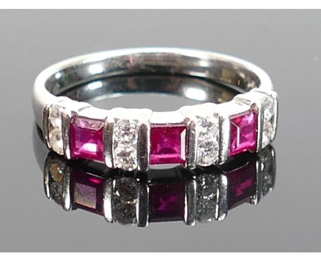 18ct white gold ruby &amp; diamond ring: Set with three square rubies and 8 small diamonds, size N/O, 3.1g.