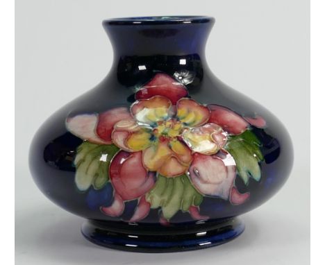 Walter Moorcroft small vase decorated all around in the Columbine design: Height 7.5cm.