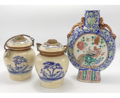 A collection of Chinese porcelain crackle glazed vases: comprising two handled flask and pair cracked glaze jar &amp; covers,