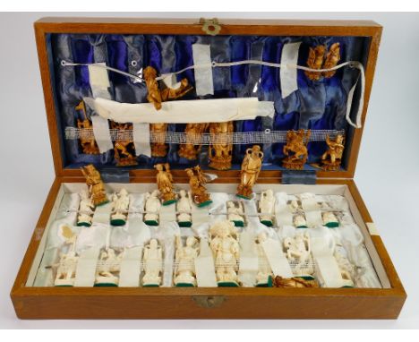 Cased Mid Century Chinese chess set: set of light and dark Chinese figures complete in folding box wood box with board (some 