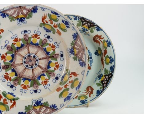 Two 18th century English Polychrome Delft plates: Described as Lambeth London c 1750, both with extensive damage and enamel c
