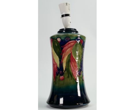 Walter Moorcroft lamp base decorated in the Leaf and Berry design: Height of pottery 29cm. 