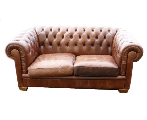 Leather Natuzzi branded brown Chesterfield type two seater Sofa: 74cm high x 100cm deep x 174cm wide approx. 