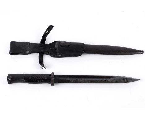 A German K98 bayonet, by WKC, 1941, with matching scabbard, the blade and scabbard stamped '2346v', with leather frog, 41cms 
