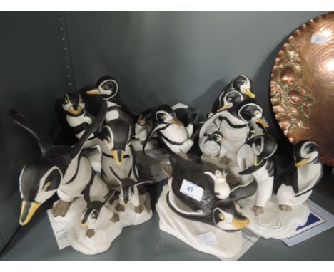 A selection of ceramic figures by the Franklin Mint all penguin themed