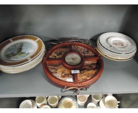 A selection of vintage ceramic display plates and wall mounted clock