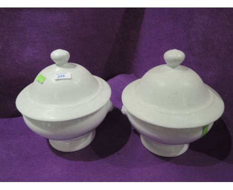 Two vintage ceramic lidded urns 