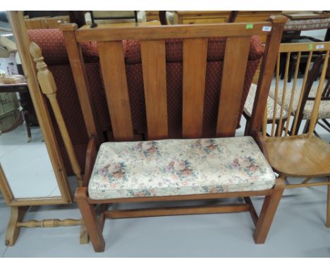 A vintage stained frame pew style bench seat