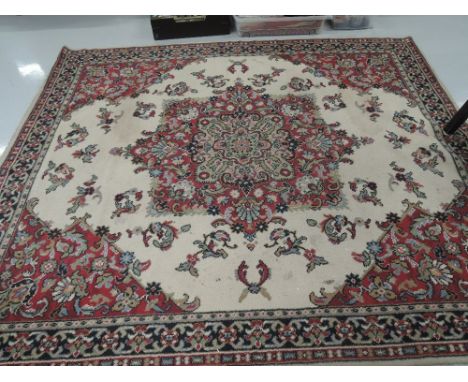 A vintage carpet square of foliate design