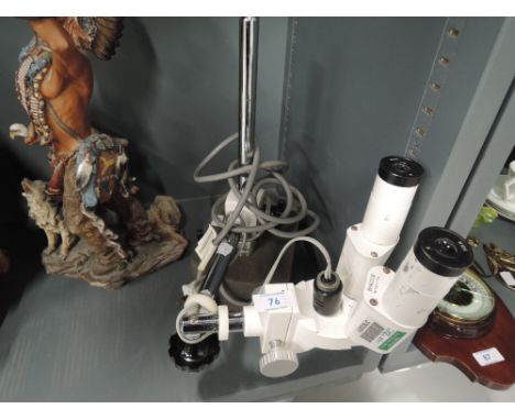 A vintage binocular microscope BM620B with light