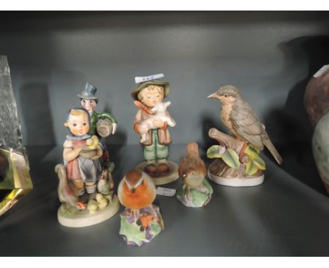 A selection of figurines including Goebel, Royal Worcester etc