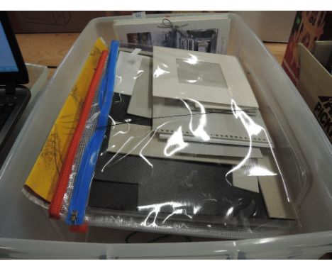 A box of framing and paper, sketch pads etc