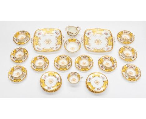 A Coalport yellow batwing teaset, pattern number Y 2665, comprising eleven cups, ten saucers, twelve side plates, two square 