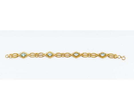 A blue topaz and 9ct gold bracelet, comprising alternate oval claw set blue topaz and gate style gold links, width approx 10m