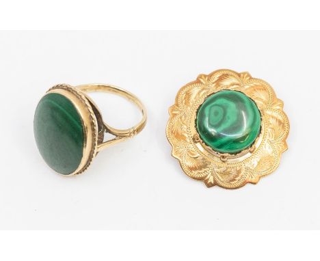 A malachite and 9ct gold ring set with oval cabohon stone within a rope border, setting approx 17 x 22mm, size P, along with 