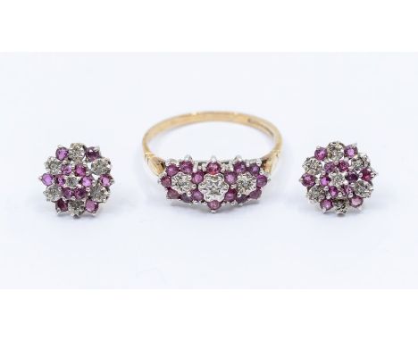 A ruby and diamond 9ct gold ring comprising three flower clusters set in a row, claw set with round cut rubies and diamonds c