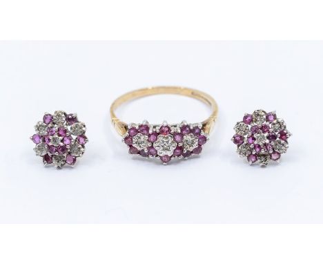 A ruby and diamond 9ct gold ring comprising three flower clusters set in a row, claw set with round cut rubies and diamonds c