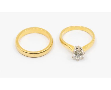 A diamond and 18ct gold solitaire ring, comprising a round brilliant cut diamond weighing approx 0.80ct in six claw setting, 