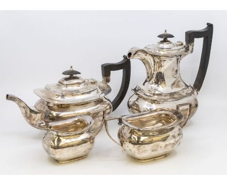 A George VI silver matched four piece tea service to include: teapot, hot water jug, sugar bowl and milk jug, plain bodies, h