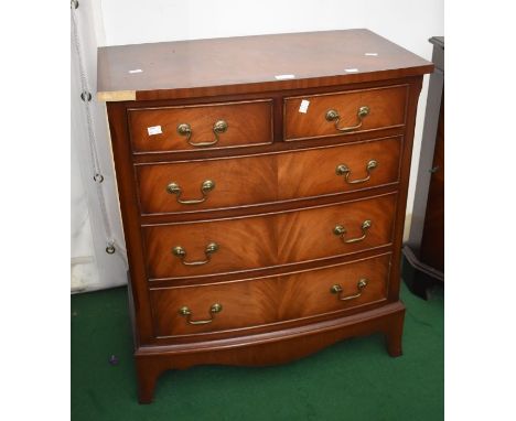 Two sets of reproduction Georgian style drawers, both having four drawers, one with vanity tray, both on bracket feet