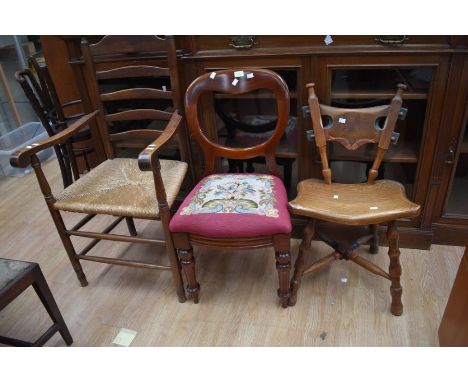 19th Century oak country kitchen armchair, ladder back, reeded seat, along with Victorian balloon back, 20th Century folk cha