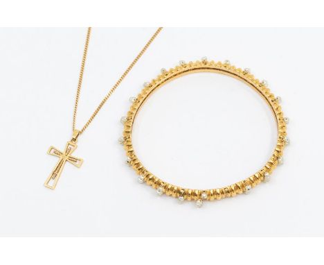 A pearl and 21ct gold bangle, comprising a ridged domed form decorated with applied fresh watcher cultured pearls, (bangle mi