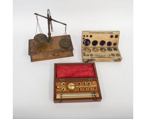 19th century Weighing Scales in an oak case with 19th century weights in a box and a late 19th century Sikes Hydrometer in a 