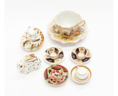 Four miniature cups and saucers, two Derby animal paperweights, Dresden cup and saucer