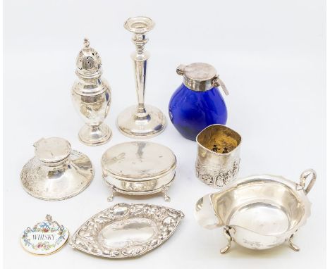 A George VI silver sauce boat, Sheffield 1938; a George V silver pepperette, London 1911; an Edwardian silver pin tray, Birmi