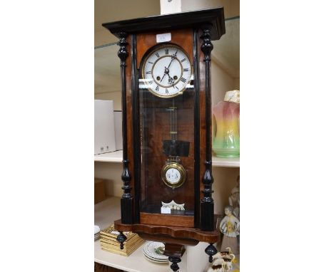 A Vienna wall clock with 5" two piece dial, spring driven two train movement, chiming on a gong, contained in a walnut style 