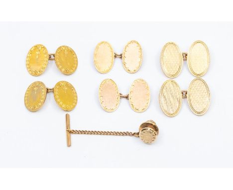 Three pairs of oval 20th century cufflinks to include engine turned and engraved versions, two pairs cased, combined weight a