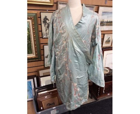 A 1920's pale blue satin kimono, used as a dressy robe, embroidered with the cherry blossom design (original owner wore on ho