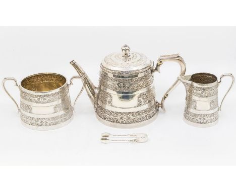  A Victoria Anglo-Indian style three piece silver tea service comprising teapot, sugar bowl, milk jug, decorative chased patt