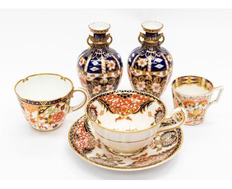 A pair of Crown Derby vases, cup and saucer with two cups
