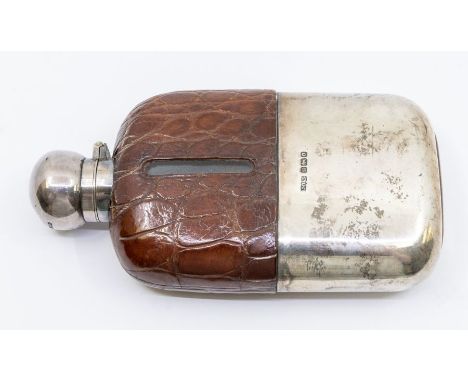 An Edwardian silver and crocodile mounted hip flask, hallmarked by James Dixon &amp; Co., Sheffield, 1906, stamped 2A to unde