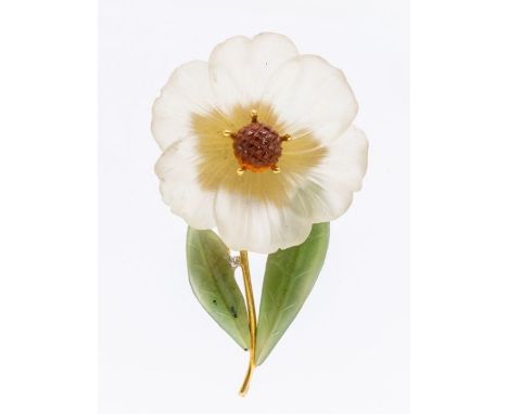  A vintage 18ct gold and carved gemstone flower brooch, comprising a carved rock crystal flower with a carved central citrine