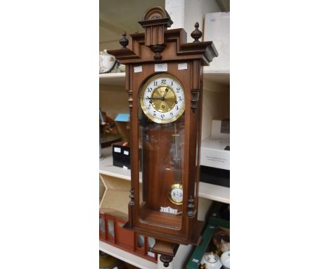 A Modern Viennese style wall clock by Herml (Franz) together with a modern giltwood ornate shaped oval mirror (2)&nbsp;