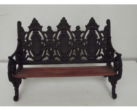 Very heavy cast metal miniature bench/bookshelf 