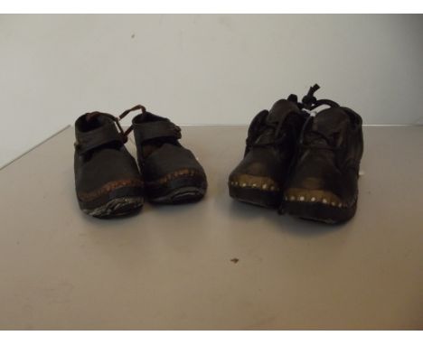 Two pairs of ceramic child's clogs 